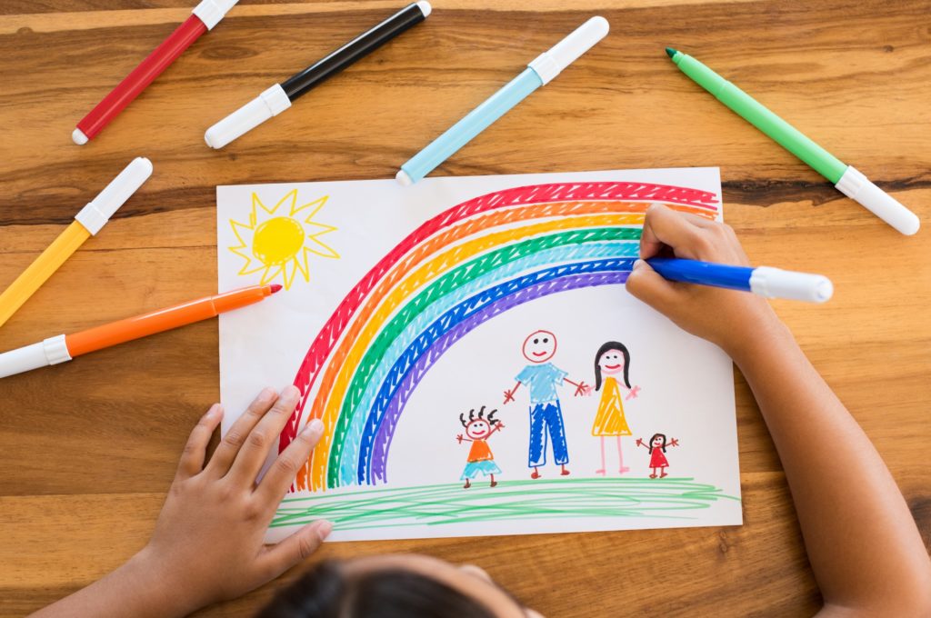 Child drawing happy family