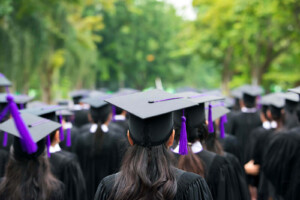 High school graduates in their cap and gowns. Showing adolescents who are ready to meet with a young adult therapist in West Bloomfield, MI. You can get tailored support with online therapy for teens and life transition counseling in Michigan.